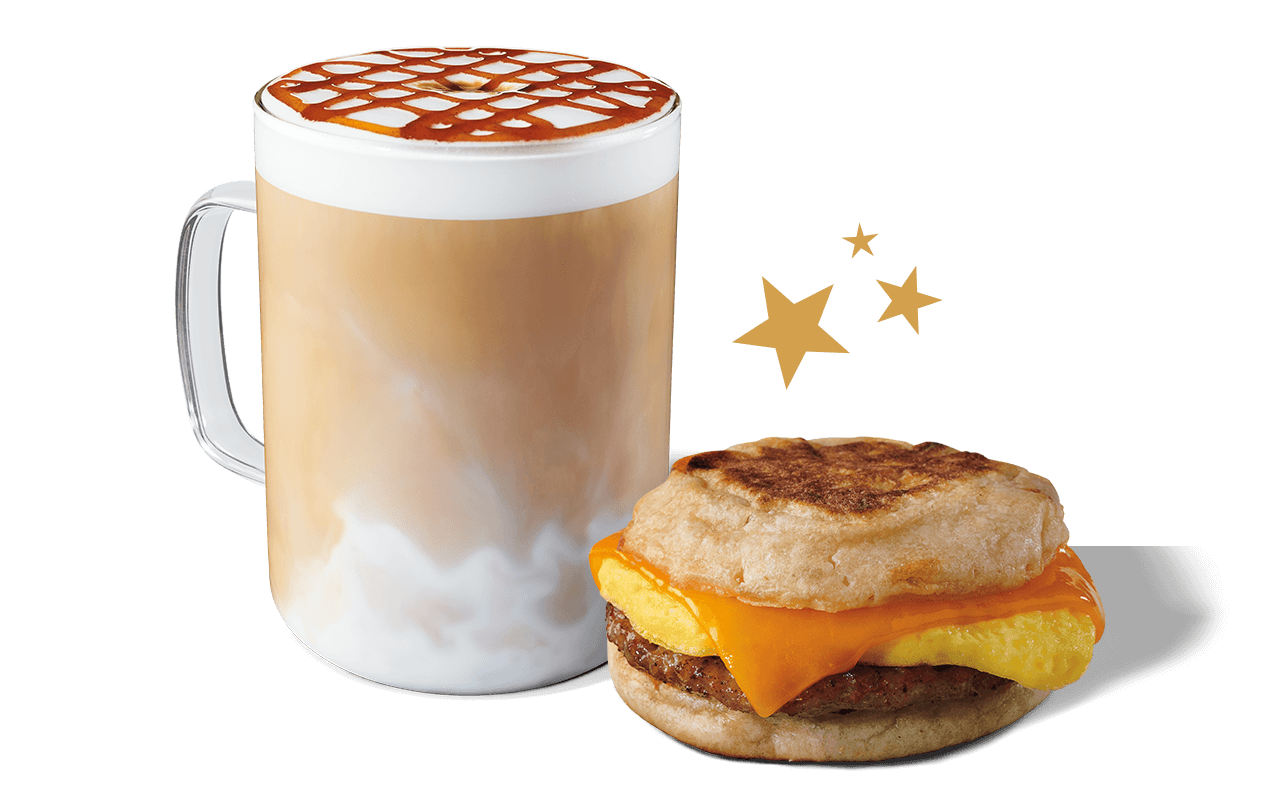 A Caramel Macchiato and Sausage, Cheddar & Egg Sandwich featured on a green background with a cluster of gold Stars.