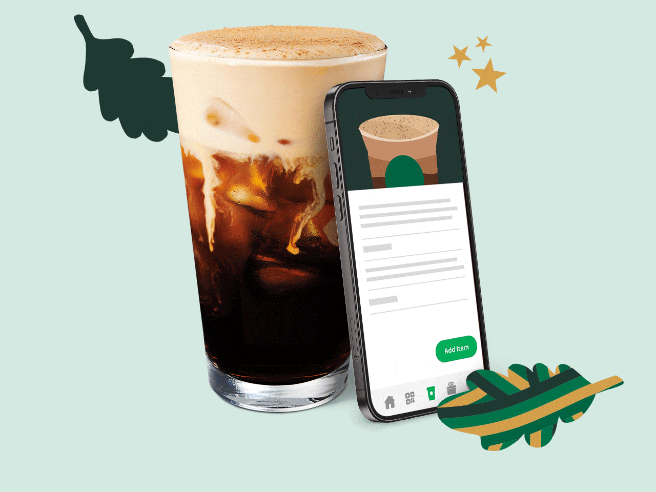 A mobile phone showing the Starbucks app is leaning against Pumpkin Cream Cold Brew or the new Iced Apple Crisp Macchiato.