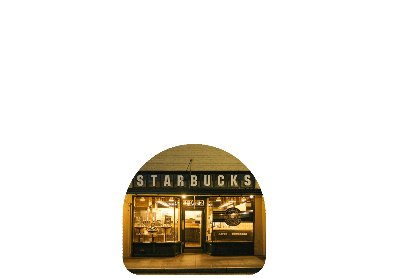 A photo of the original Starbucks Pike Place Market store sits below the words: Starbucks® Starland: 50th Anniversary Edition.