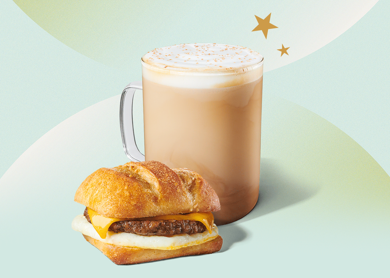 A Pistachio Latte and a Beyond Meat®, Cheddar & Egg Sandwich are feature on light background. Two gold Stars move in the upper right of the image.