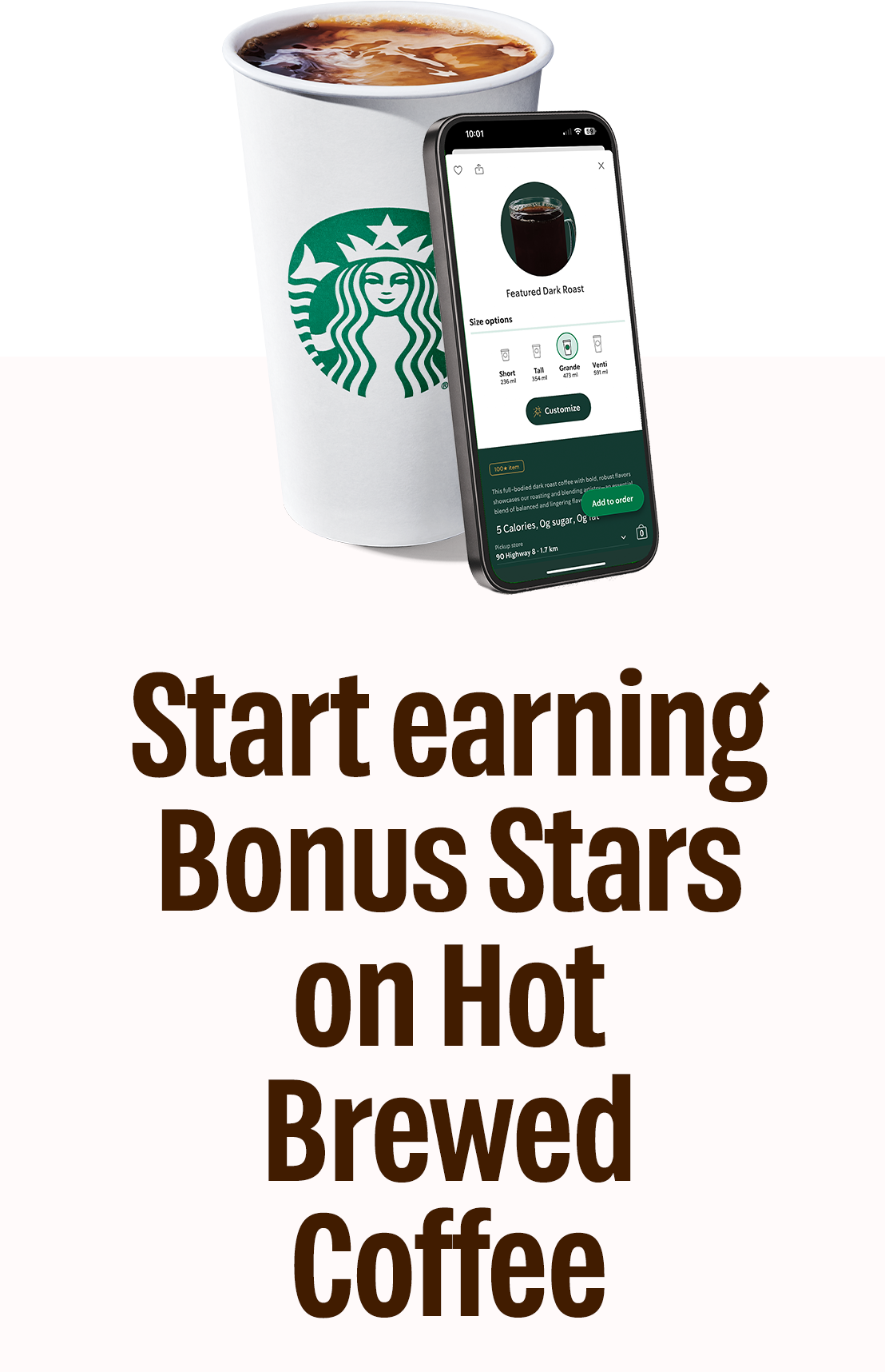 Start earning Bonus Stars on Hot Brewed Coffee | A front view of a Hot Brewed Coffee with a creamy marbling on top in a to go cup with a smartphone leaning against it that has the Starbucks® app open.