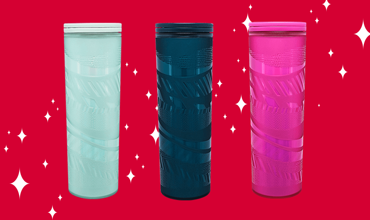 Three tall tumblers in light blue, dark green and hot pink. The background is red with white stars.