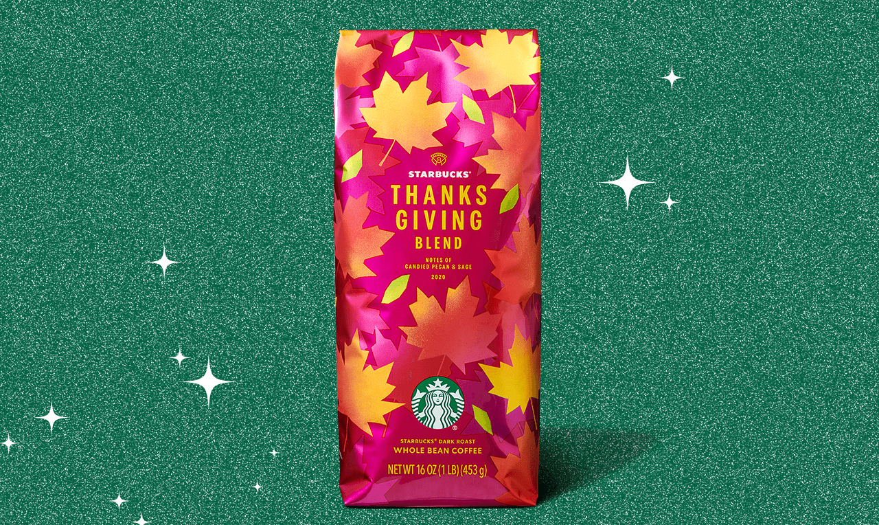 Coffee bag with a leaf design in shades of red, pink, orange and yellow. The background is green with white stars.