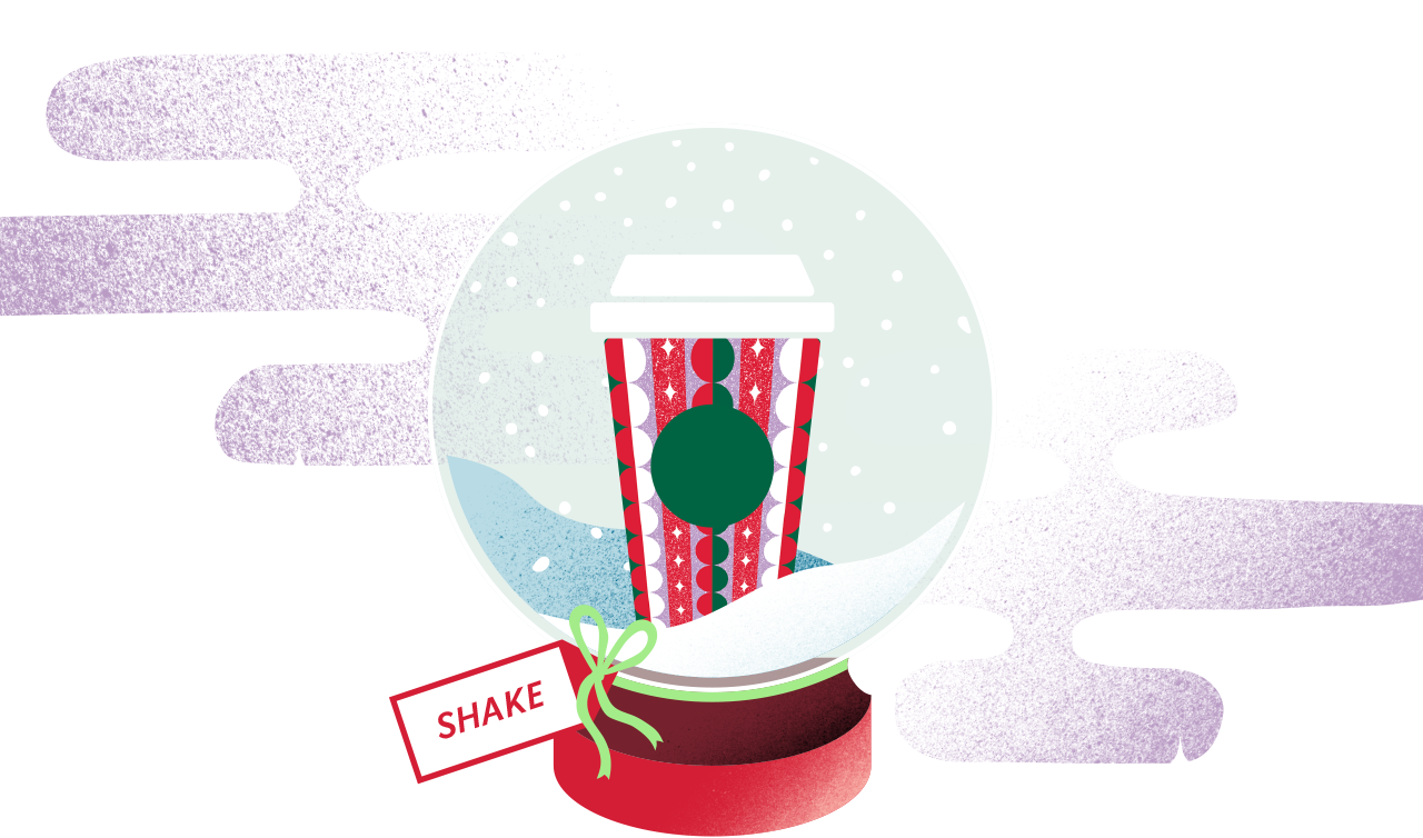 A Starbucks holiday cup in a snowglobe. A tag that says SHAKE is tied around the base.